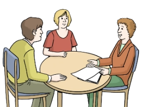 Menschen am Tisch und haben Dokumente vor sich